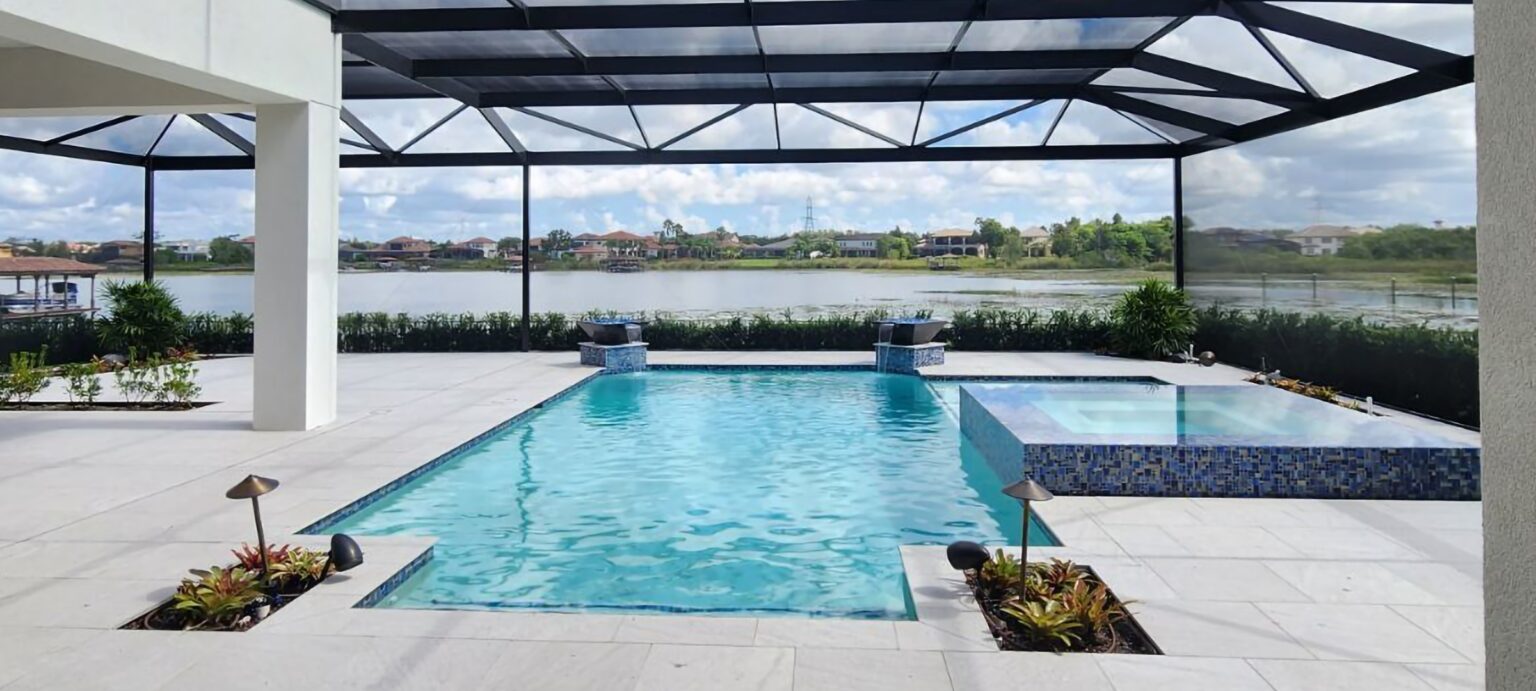 a swimming pool with a river view